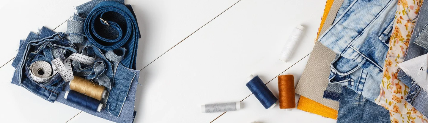 Denim, scissors and sewing materials for upcycling
